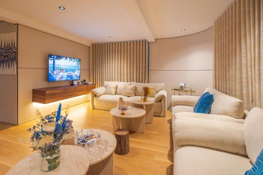 Media lounge finished in warm wood tones